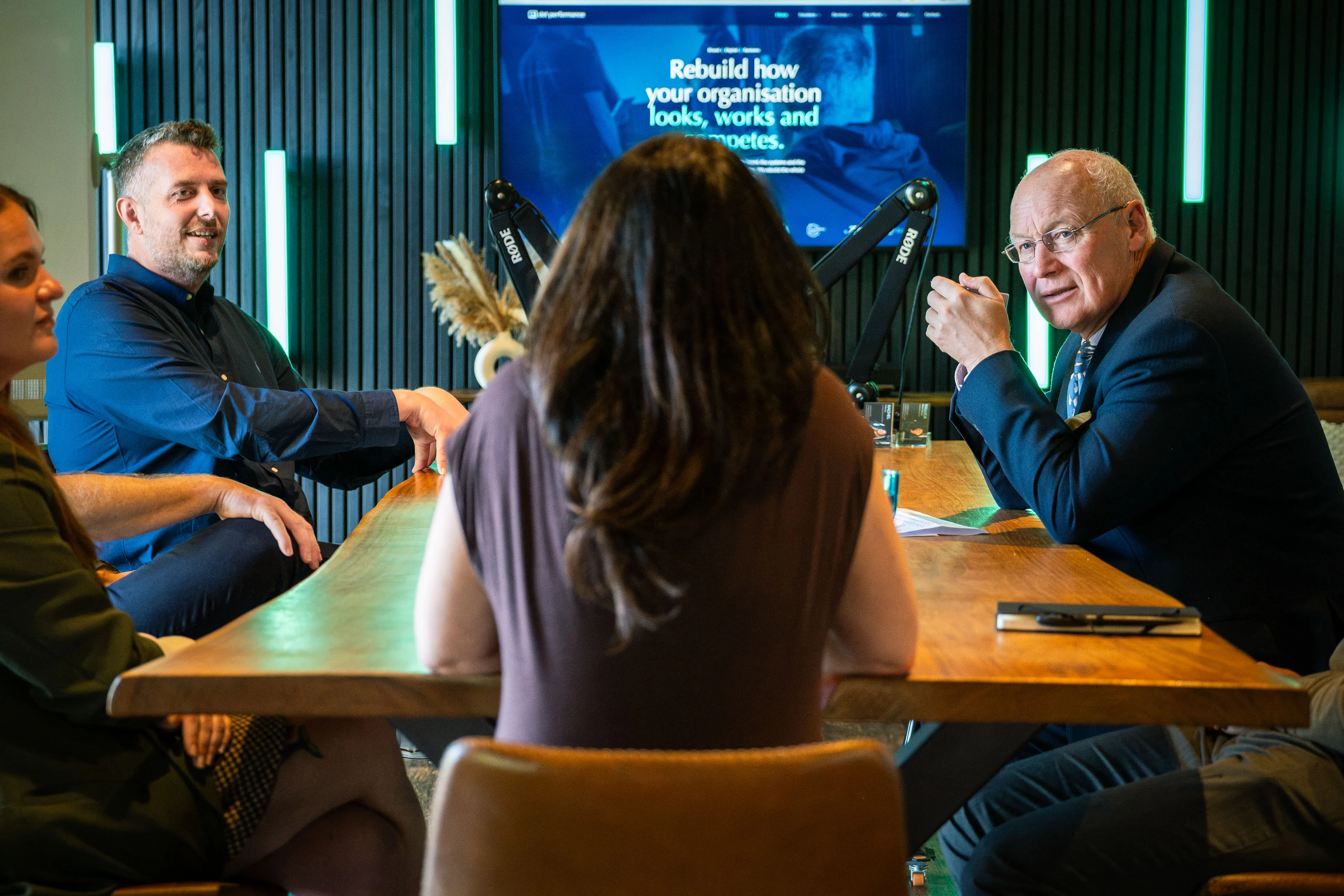 Lieutenant General Sir John Lorimer KCB DSO MBE discussing how DotPerformance transforms brands with the team around the conference table