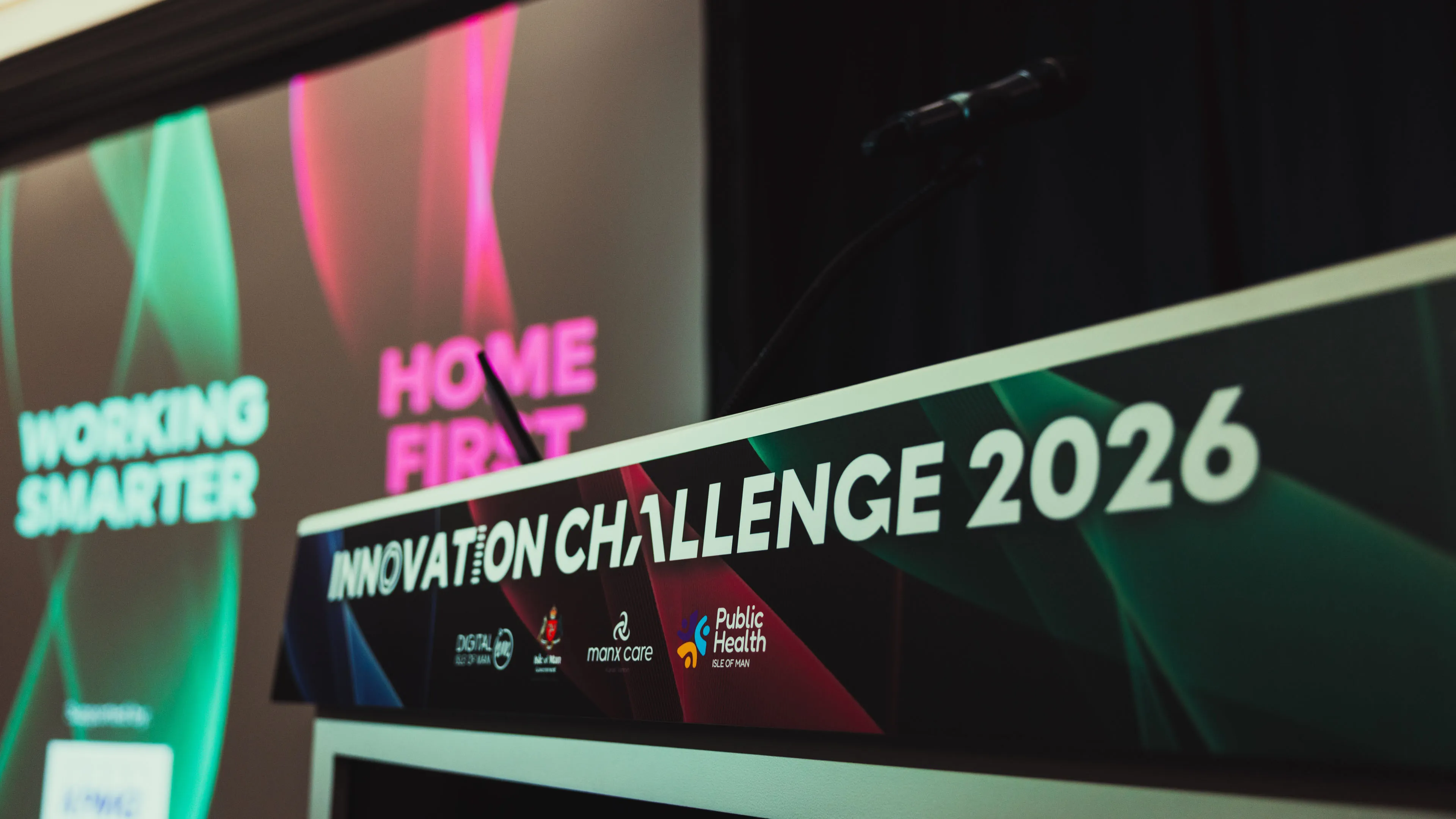 Close-up of the Innovation Challenge 2026 podium showing the Working Smarter and Home First category branding