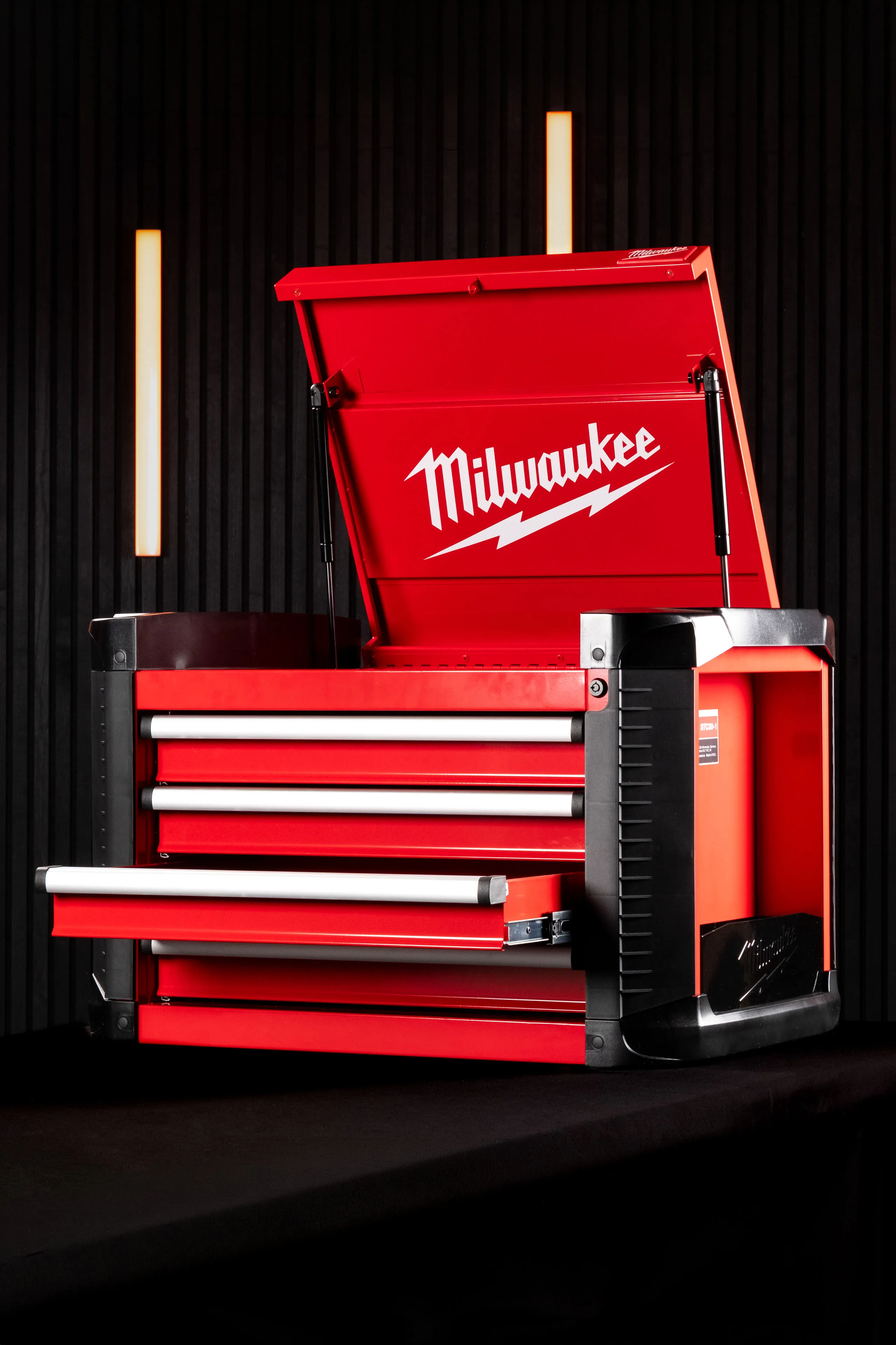 Milwaukee STC30-1 Toolbox photographed with the top lid raised and a drawer open, showing the Milwaukee branding on the lid