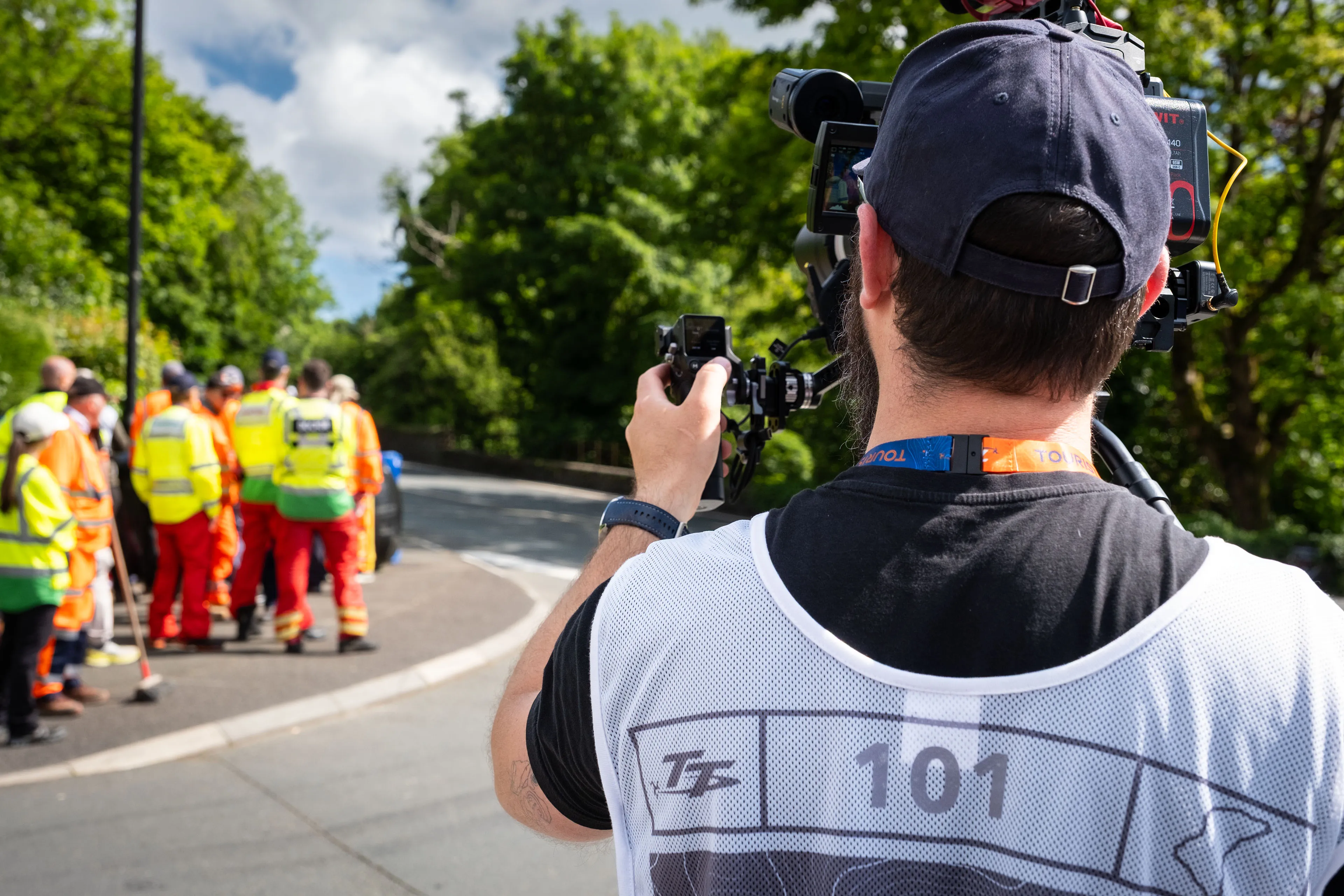 Nico van Loggerenberg filming a group of TT Marshals and MRMS doctors and paramedics stationed along the course during the TT races