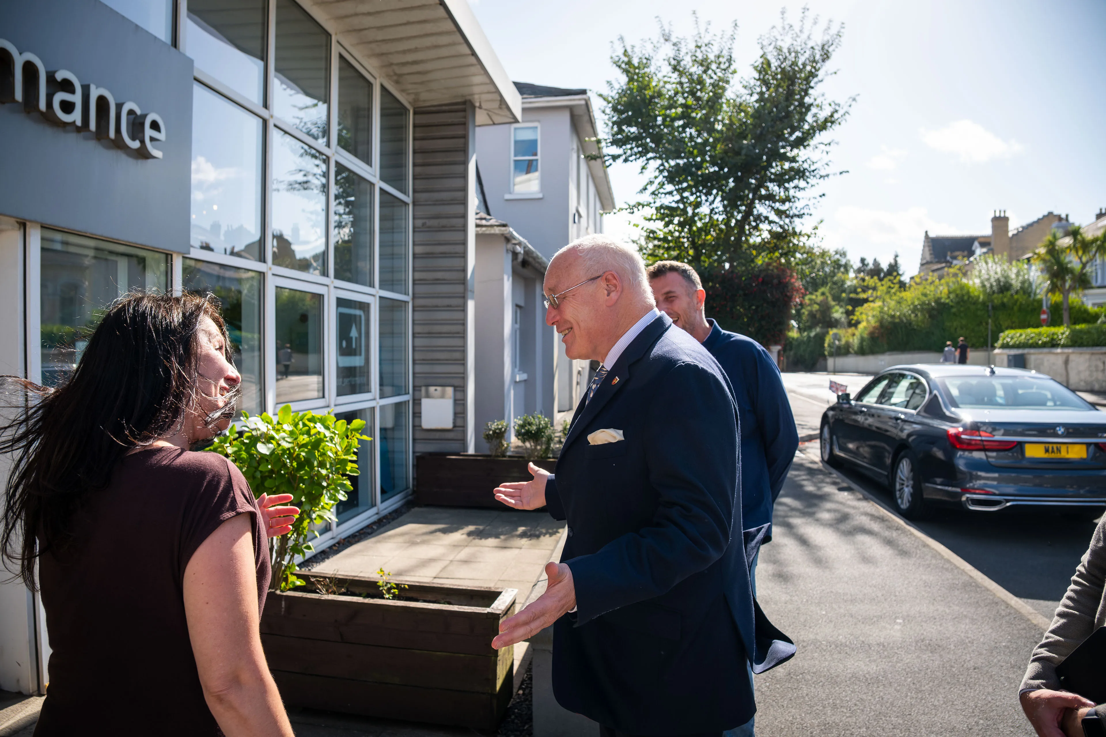 Lieutenant General Sir John Lorimer KCB DSO MBE being welcomed outside DotPerformance by Raluca Matei and Andy Orton