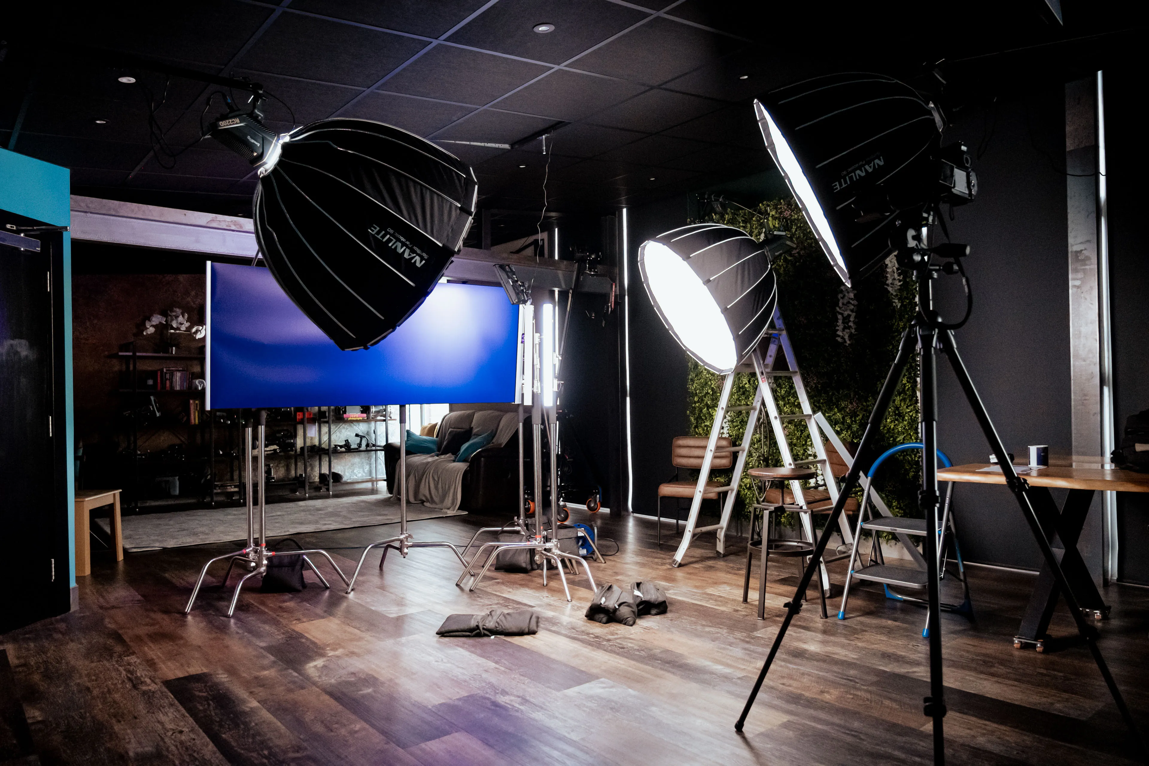 DotPerformance studio on the Isle of Man set up with Nanlite softbox lighting rigs and a blue backdrop for a photography session for TopCare.