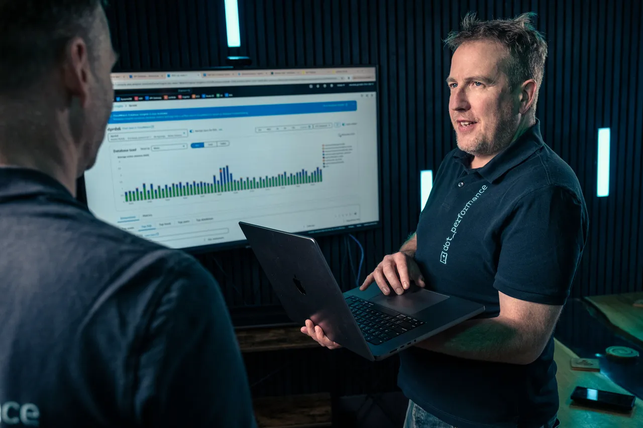 Simon Head of Digital at Dot Performance looking at analytics on laptop