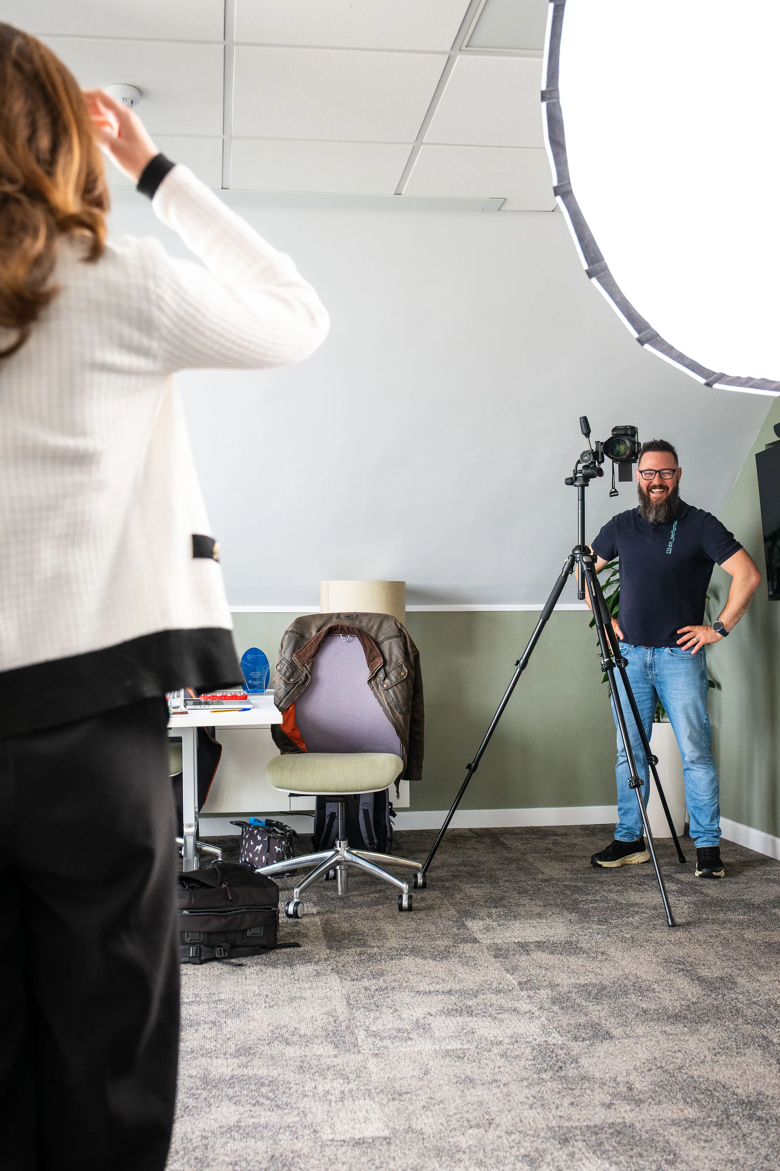 Nico van Loggerenberg having a friendly conversation with Jordan McCormack during her portrait session at Boal & Co's offices.