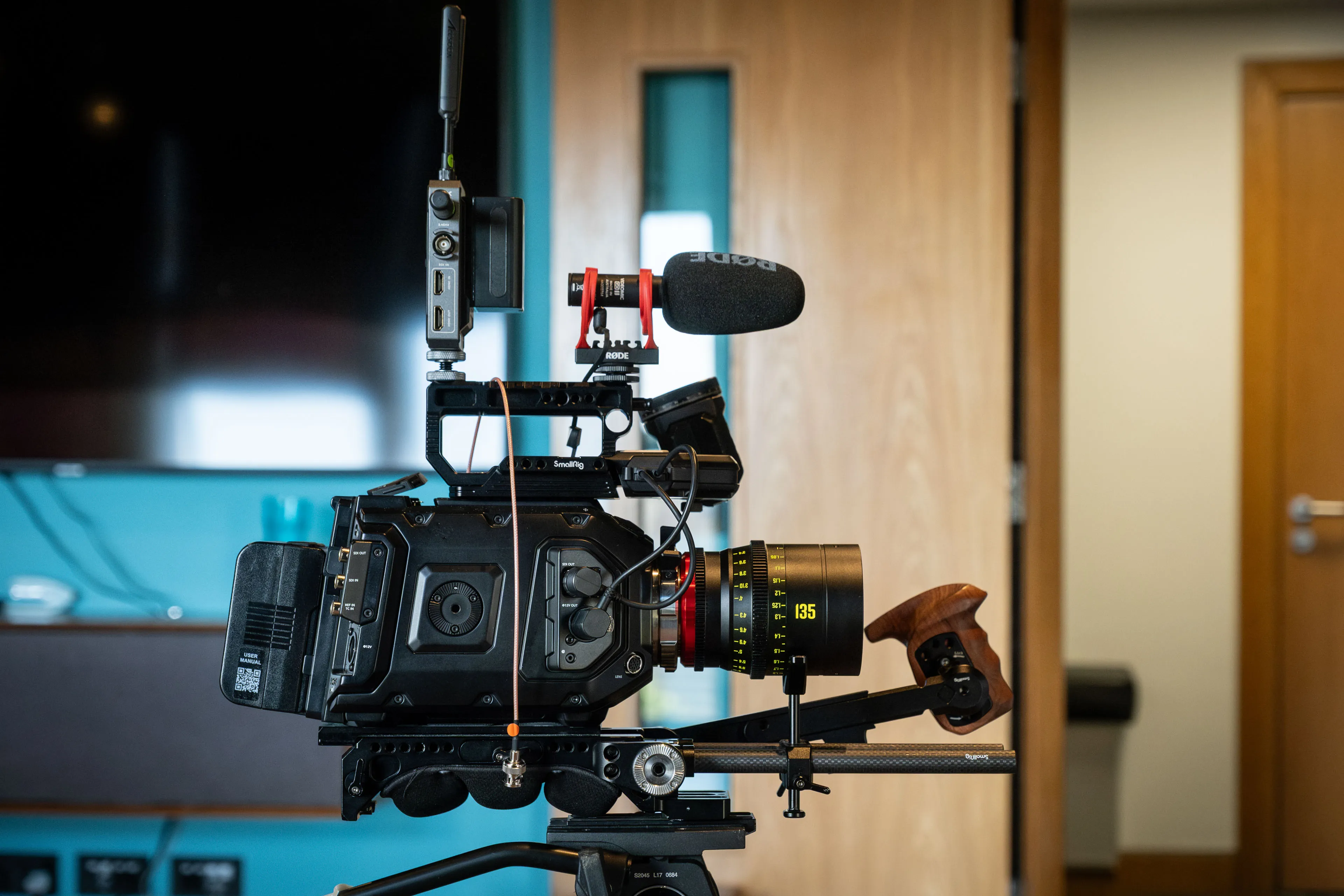 Blackmagic URSA 12K Mini Pro cinema camera on a studio rig with a Rode microphone and wireless transmitter during a podcast production at DotPerformance studios on the Isle of Man