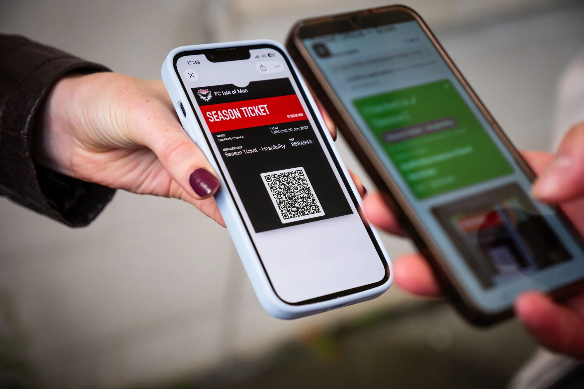 A fan scanning an FCIOM digital season ticket QR code on a phone at the gate