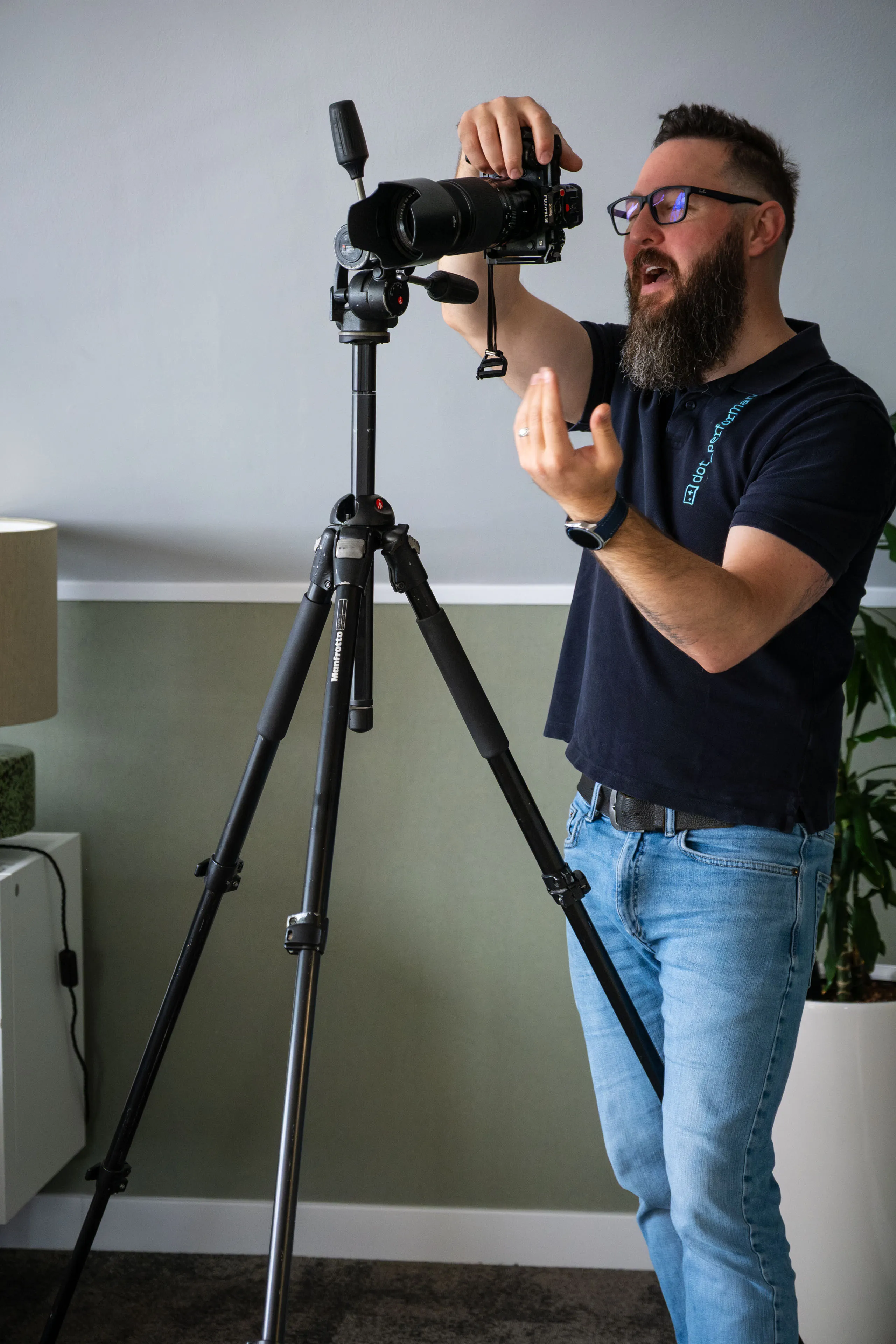 Nico van Loggerenberg gesturing for the subject to move into position during a Boal & Co portrait session