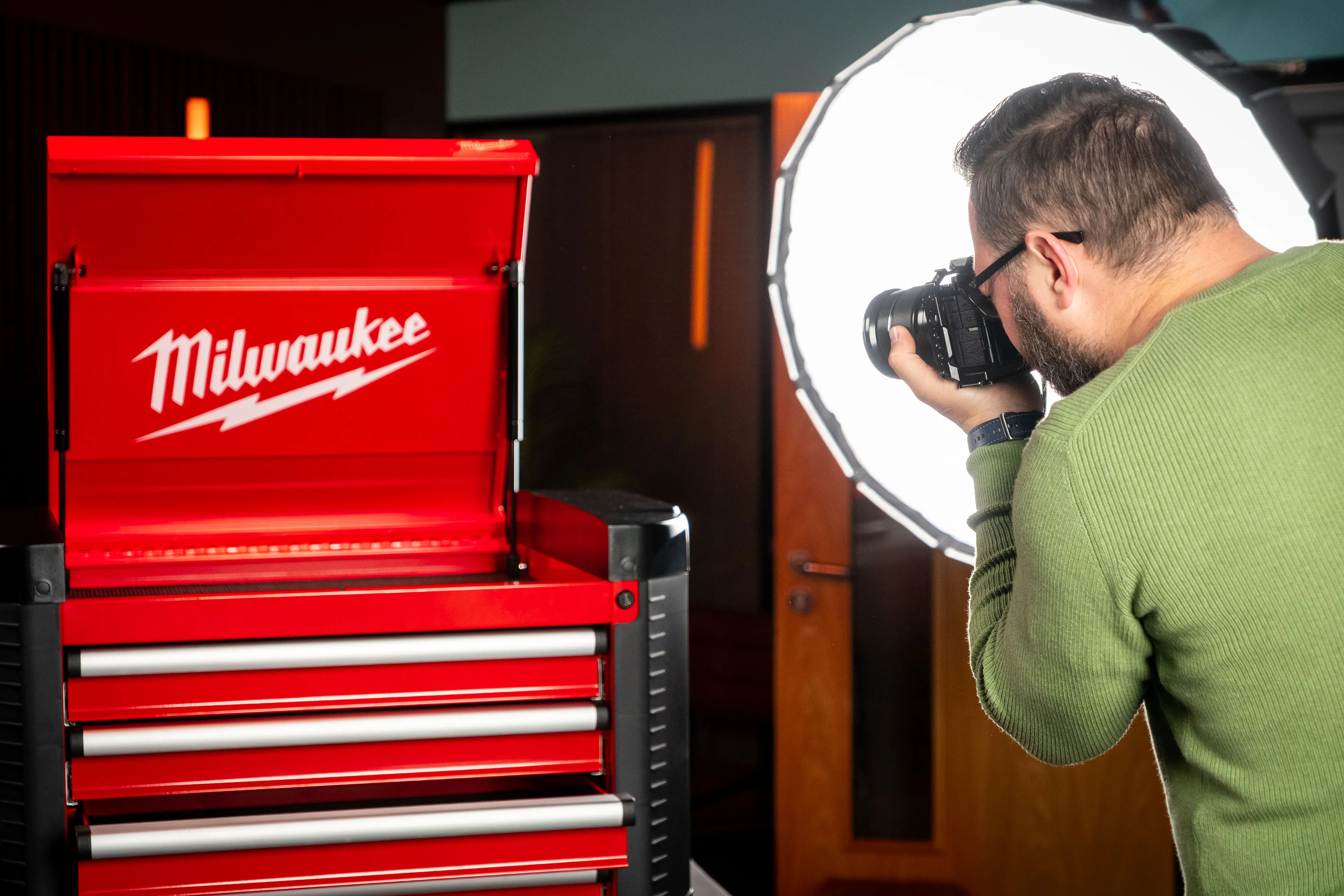 Nico van Loggerenberg photographing close-up details of the open Milwaukee STC30-1 Toolbox prize with a Fujifilm X-H2S camera under softbox lighting