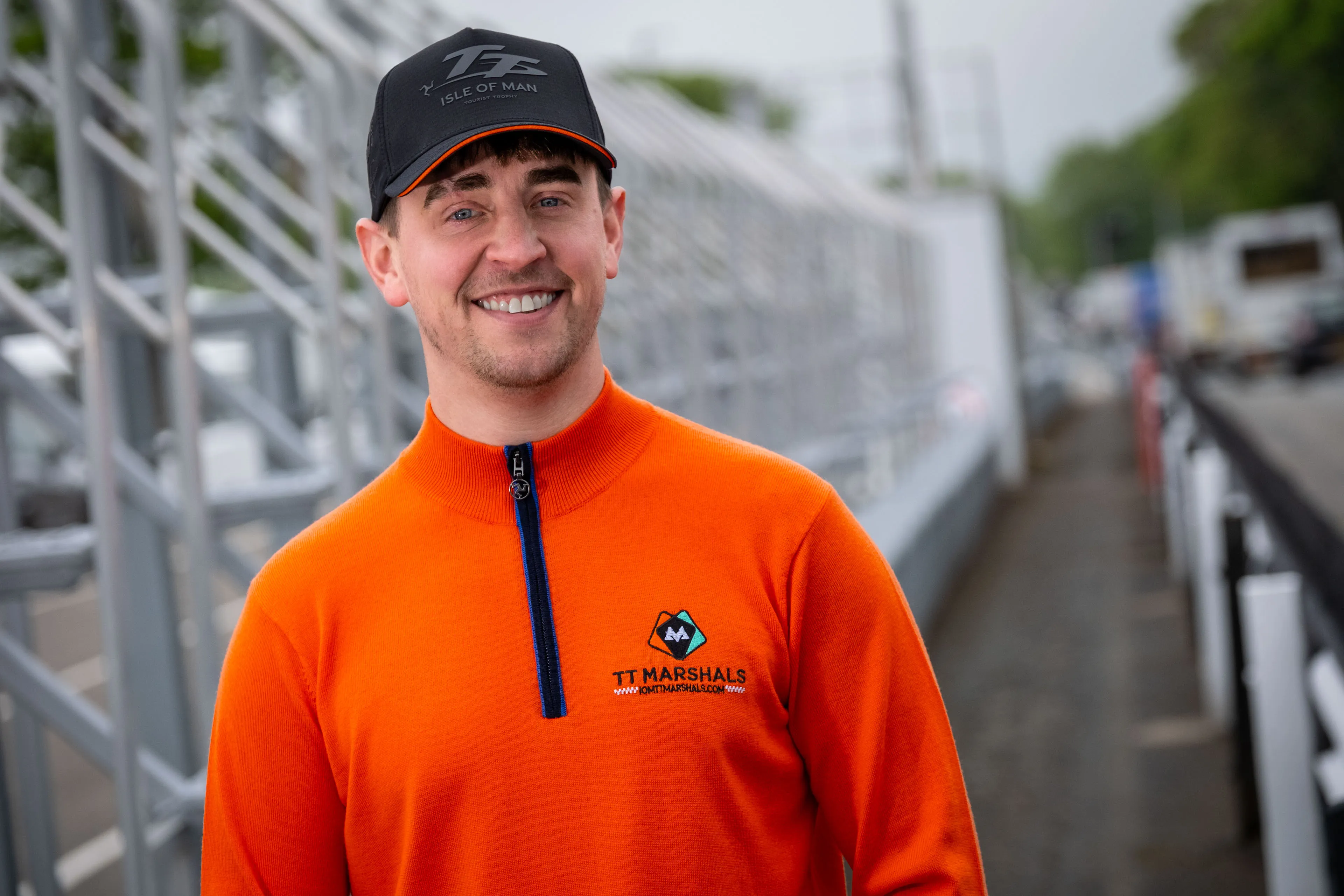 Dom Herbertson showing off the TT Marshals Albion Knitware prize jumper at the TT Grandstand