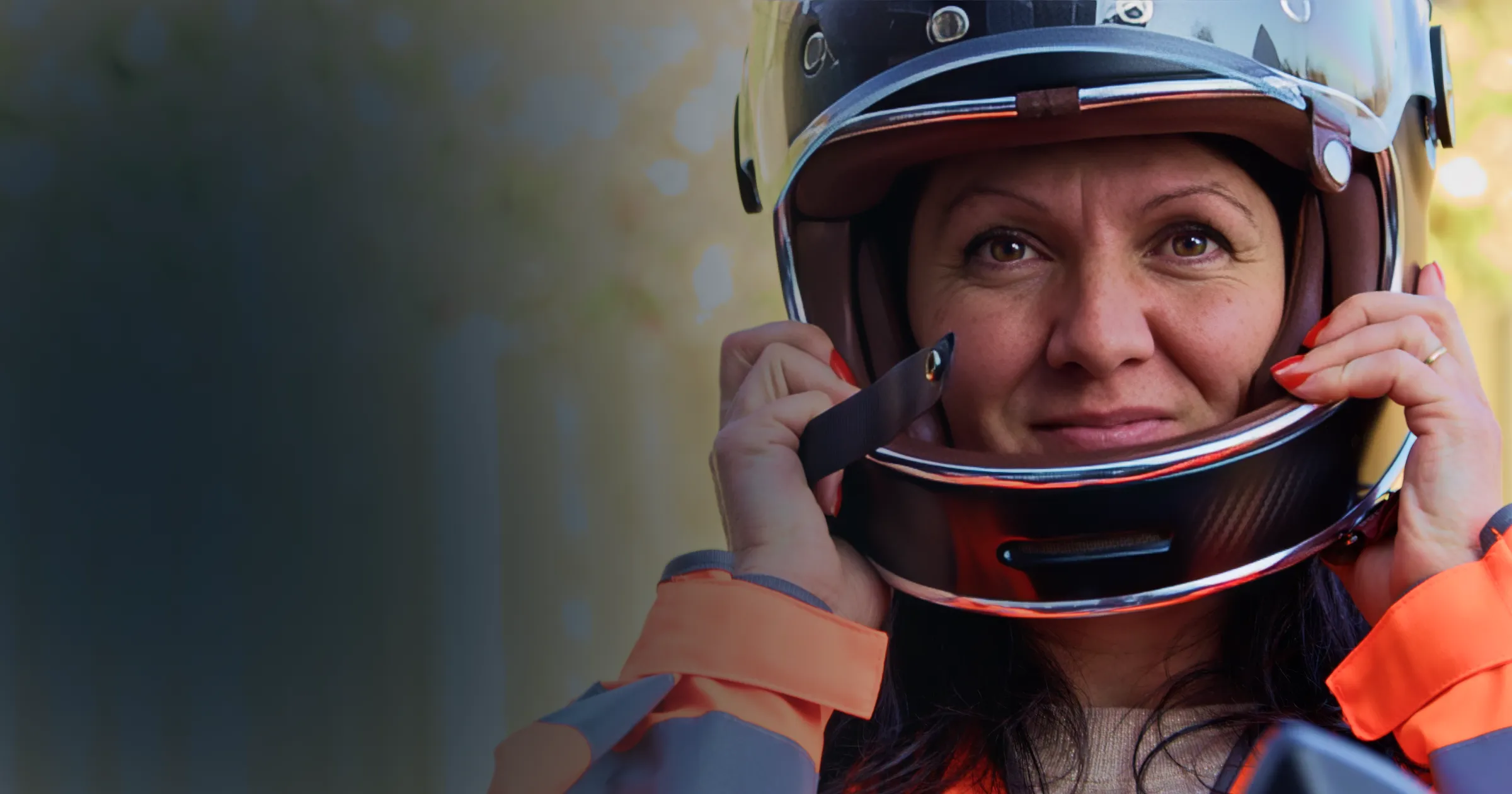 Ralu Matei Orton wearing a motorcycle helmet and Marshals jacket as she gets ready to register for the TTMA.