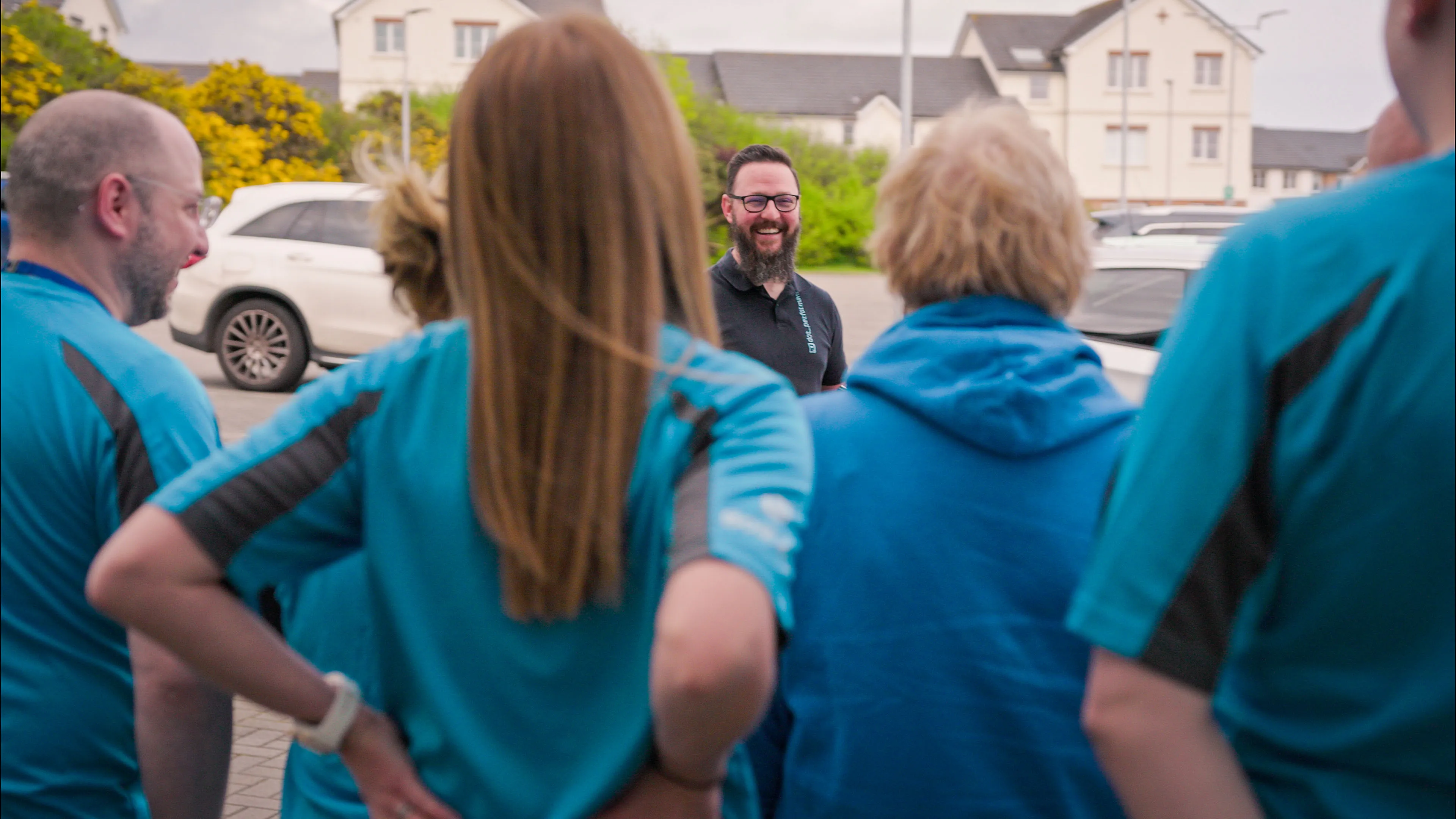 Nico van Loggerenberg from DotPerformance directing Boal & Co team members during an outdoor photography session at the Boal & Co office on the Isle of Man