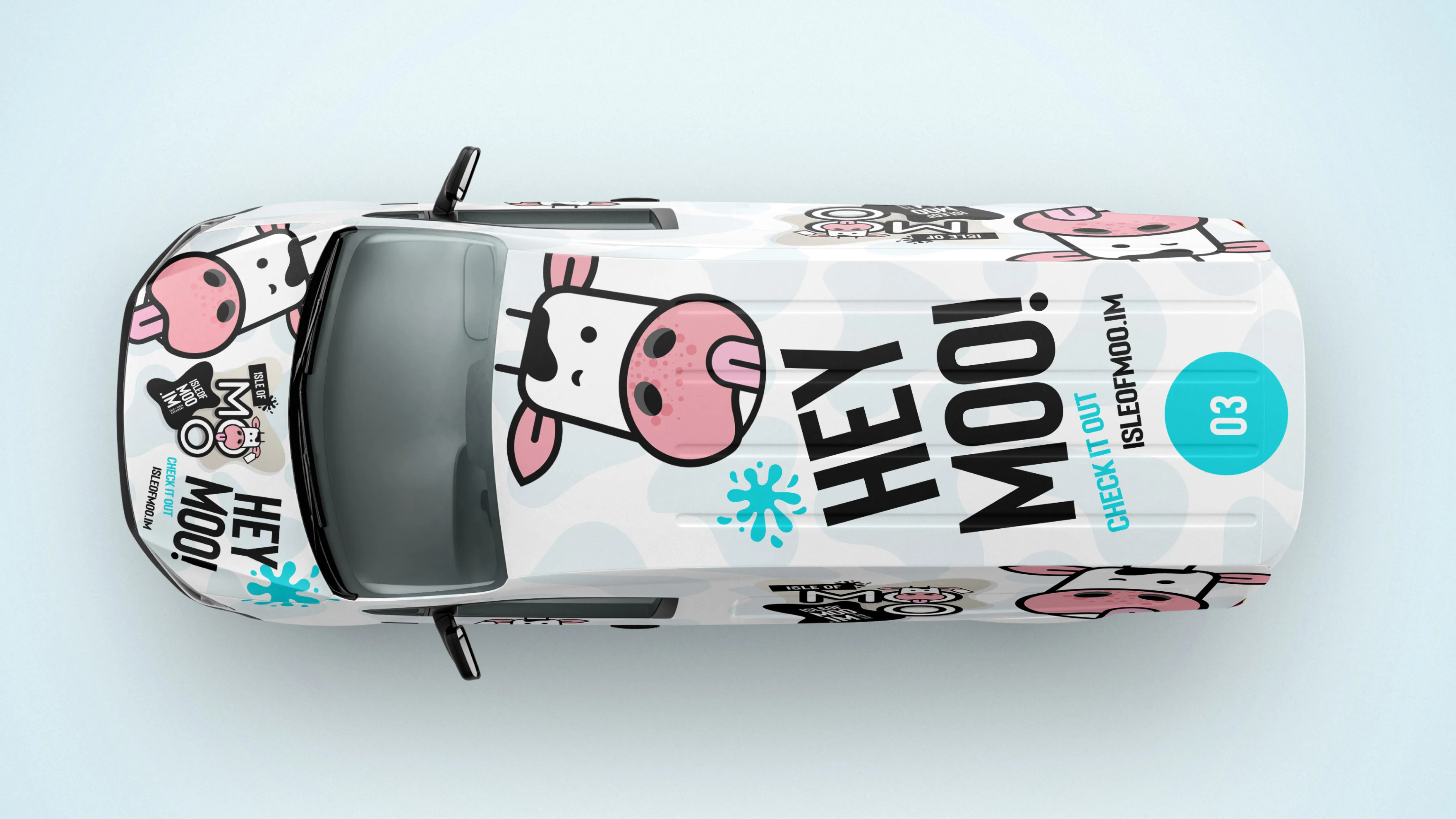Top-down view of a car wrapped in Isle of Moo “HEY MOO!” branding with cow illustrations and bold typography.