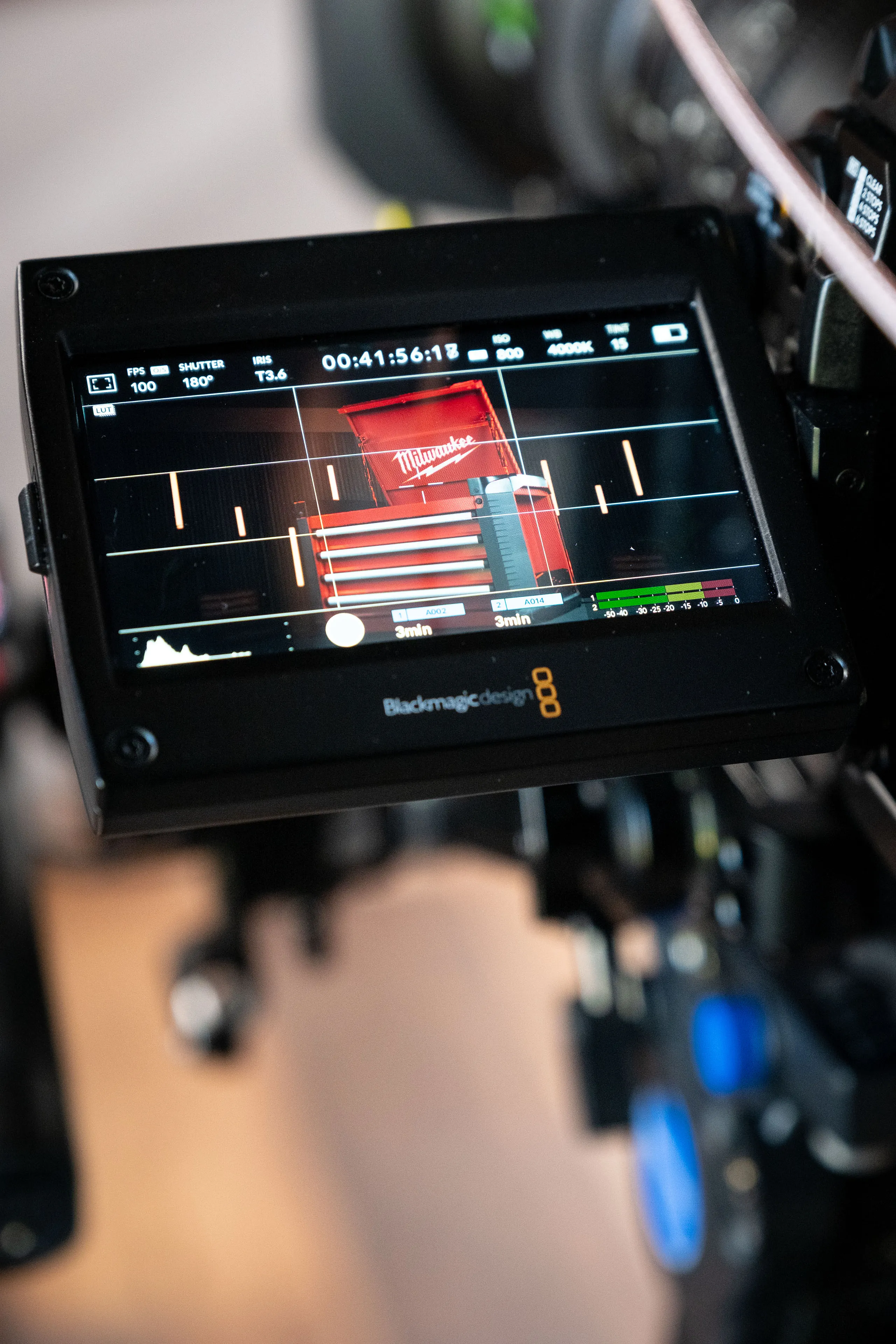 Close-up of the Blackmagic Ursa Mini's monitor displaying camera settings and the framed shot of the Milwaukee STC30-1 Toolbox prize