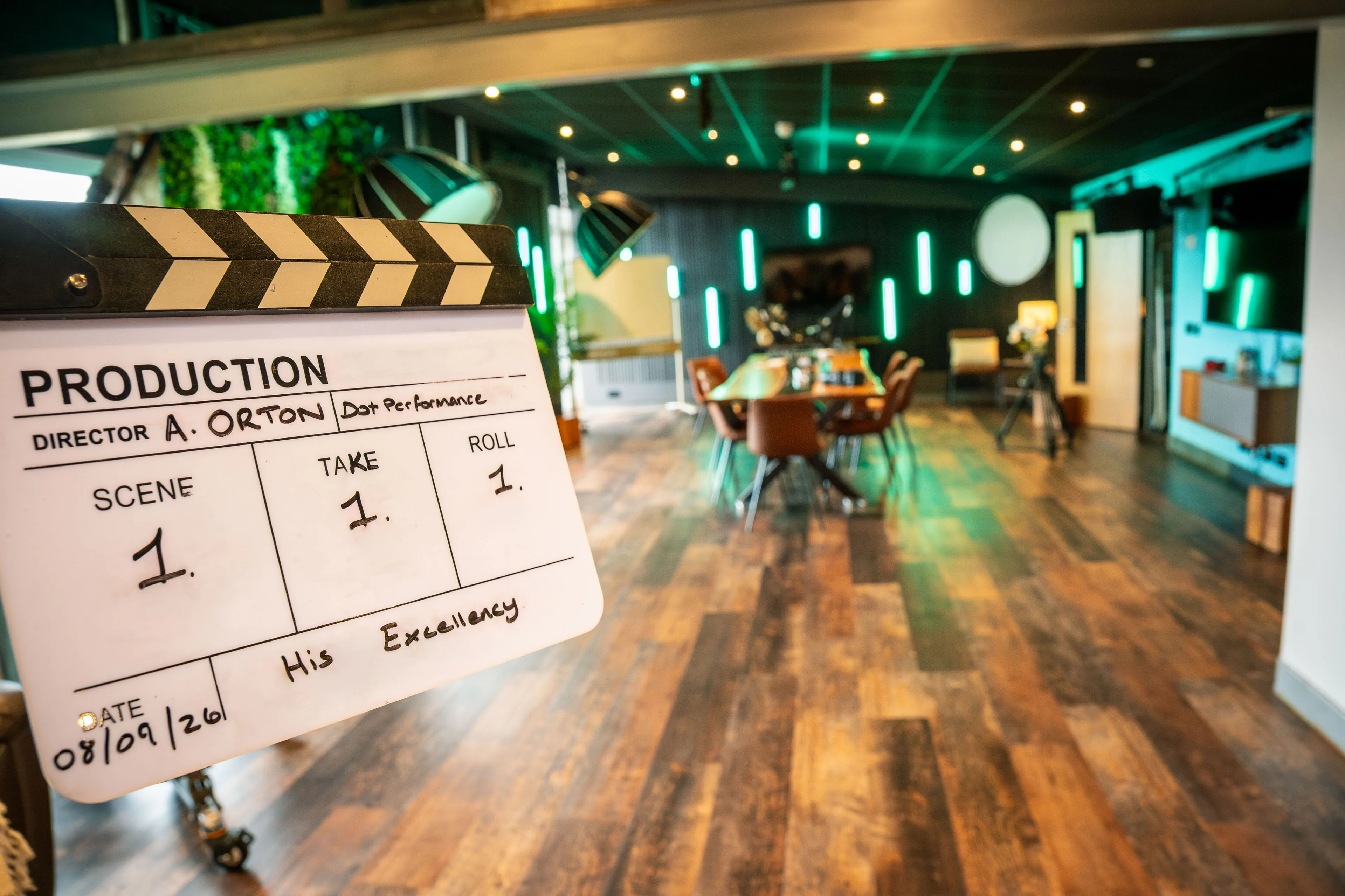 Clapperboard reading "His Excellency", directed by A. Orton, on set at DotPerformance ahead of the visit