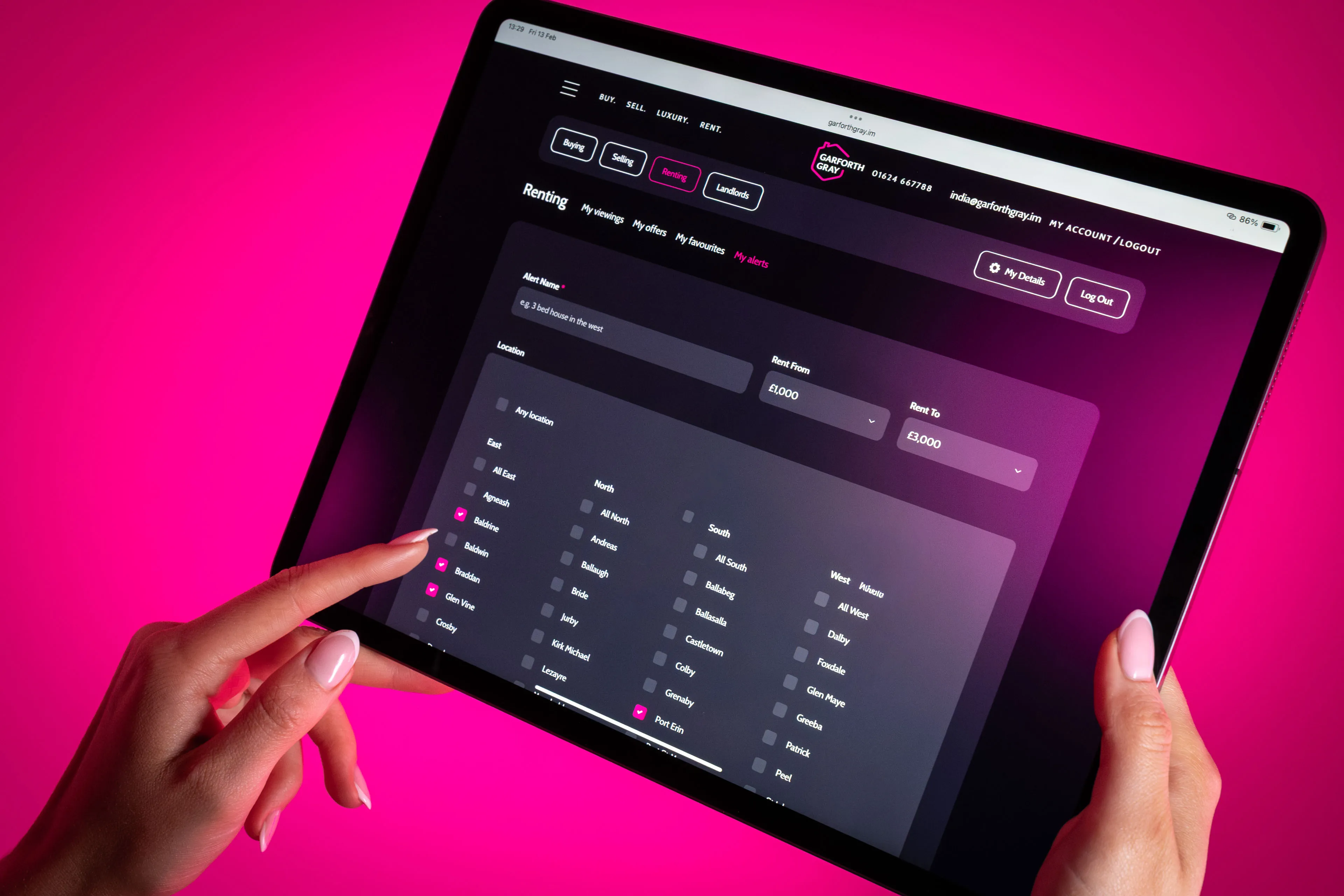A person holds a tablet displaying a rental app interface against a vibrant pink background. The screen shows property listings and search filters.
