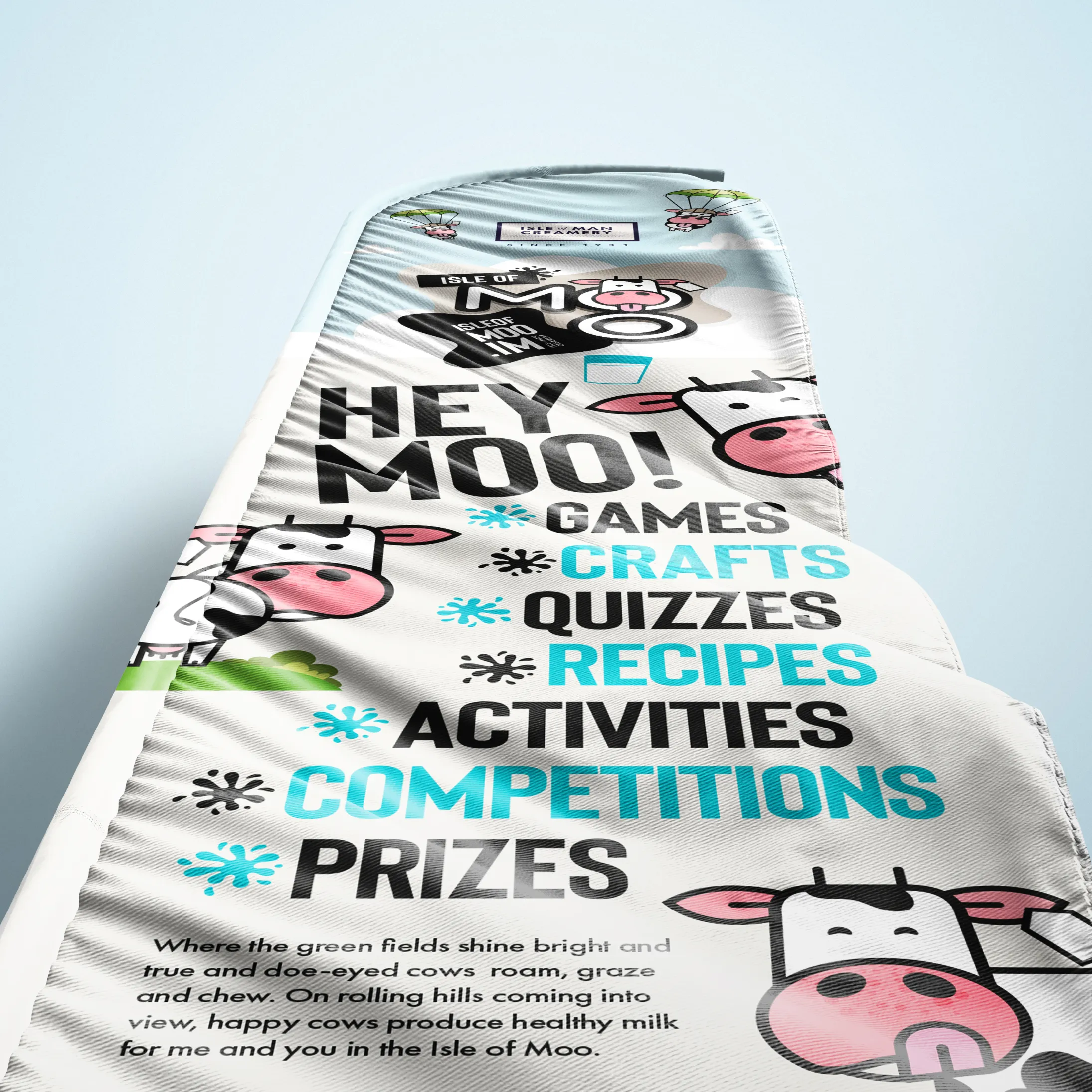 Isle of Moo branded roller banner design created by DotPerformance for the Isle of Man Creamery, showing the Hey Moo character with games, crafts, quizzes, recipes, activities, competitions and prizes listed