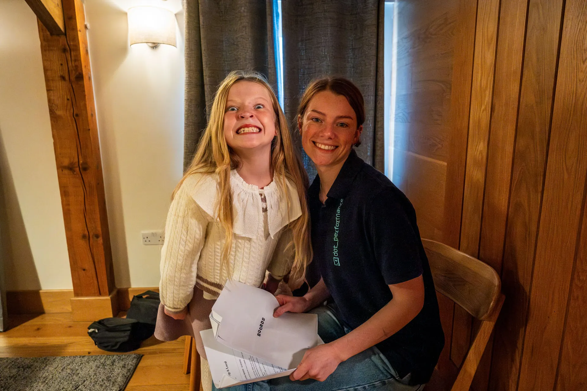 Vivi Quaye with Ella Garvey reviewing a script at The Barn at Ballaloaghtan, Isle of Man, during filming of the Business Isle of Man Buy Local Christmas campaign