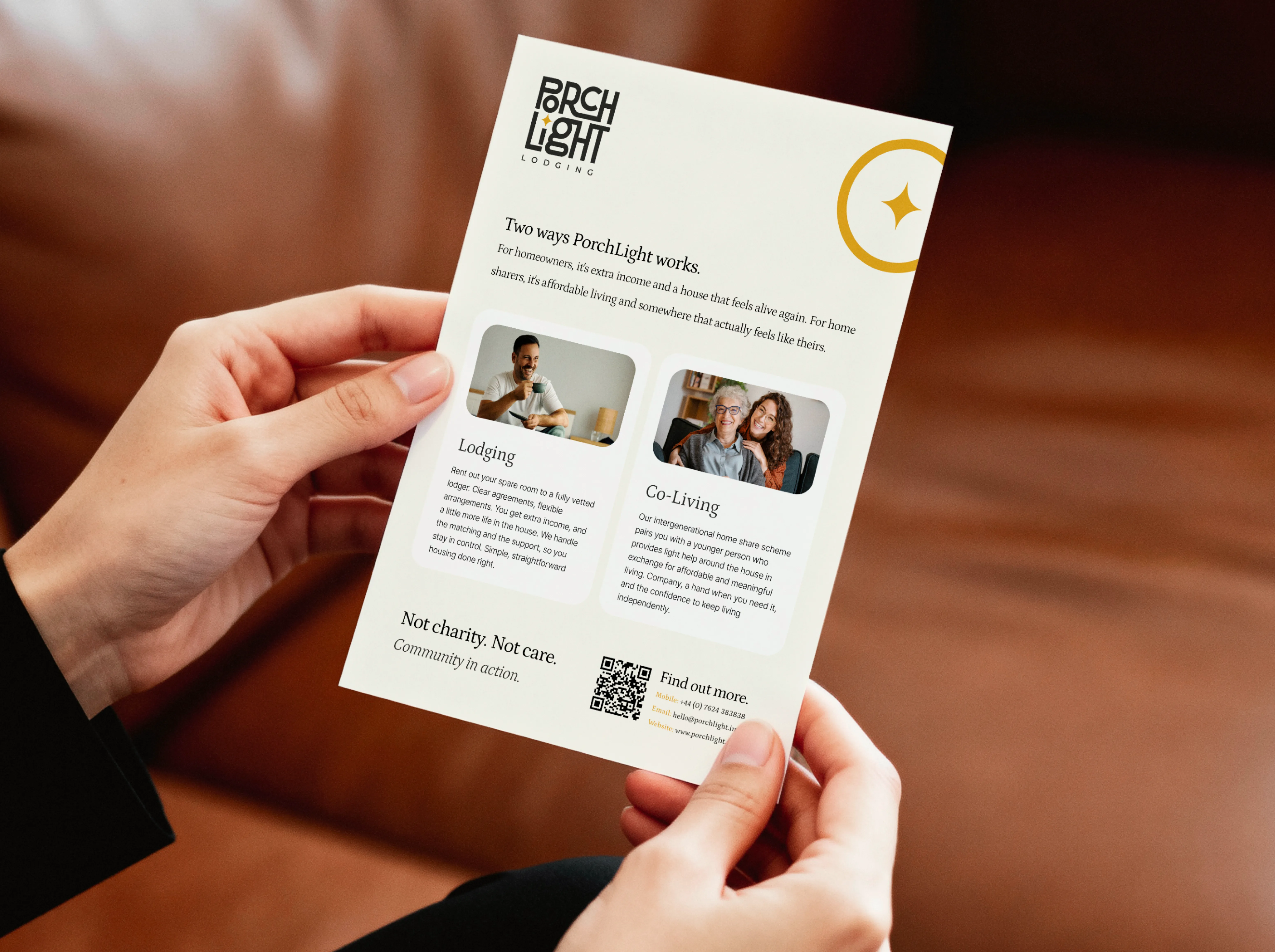 Hands holding a PorchLight Lodging flyer by DotPerformance explaining its two services, lodging and intergenerational co-living
