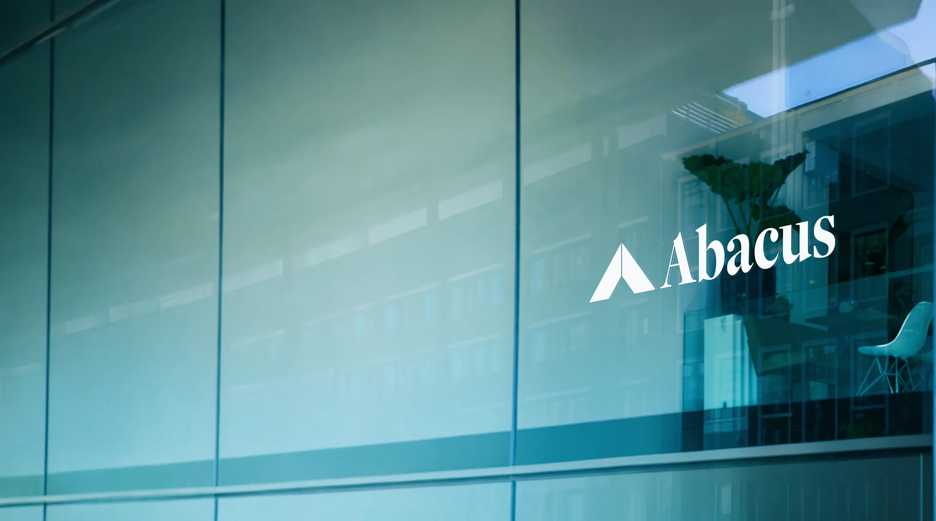 The Abacus logo on the glass of a city office