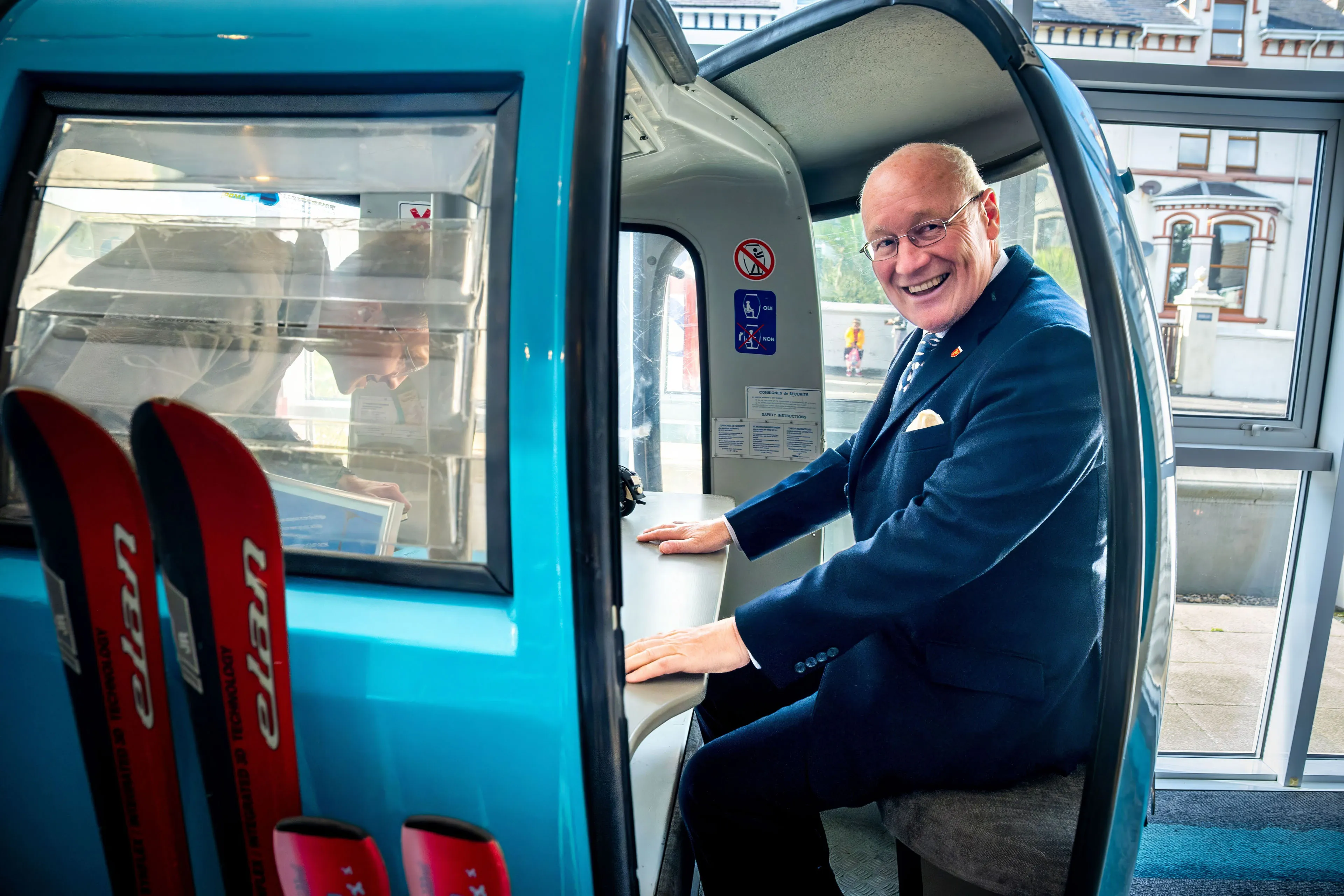 Lieutenant General Sir John Lorimer KCB DSO MBE smiling from inside the DotPerformance gondola meeting pod