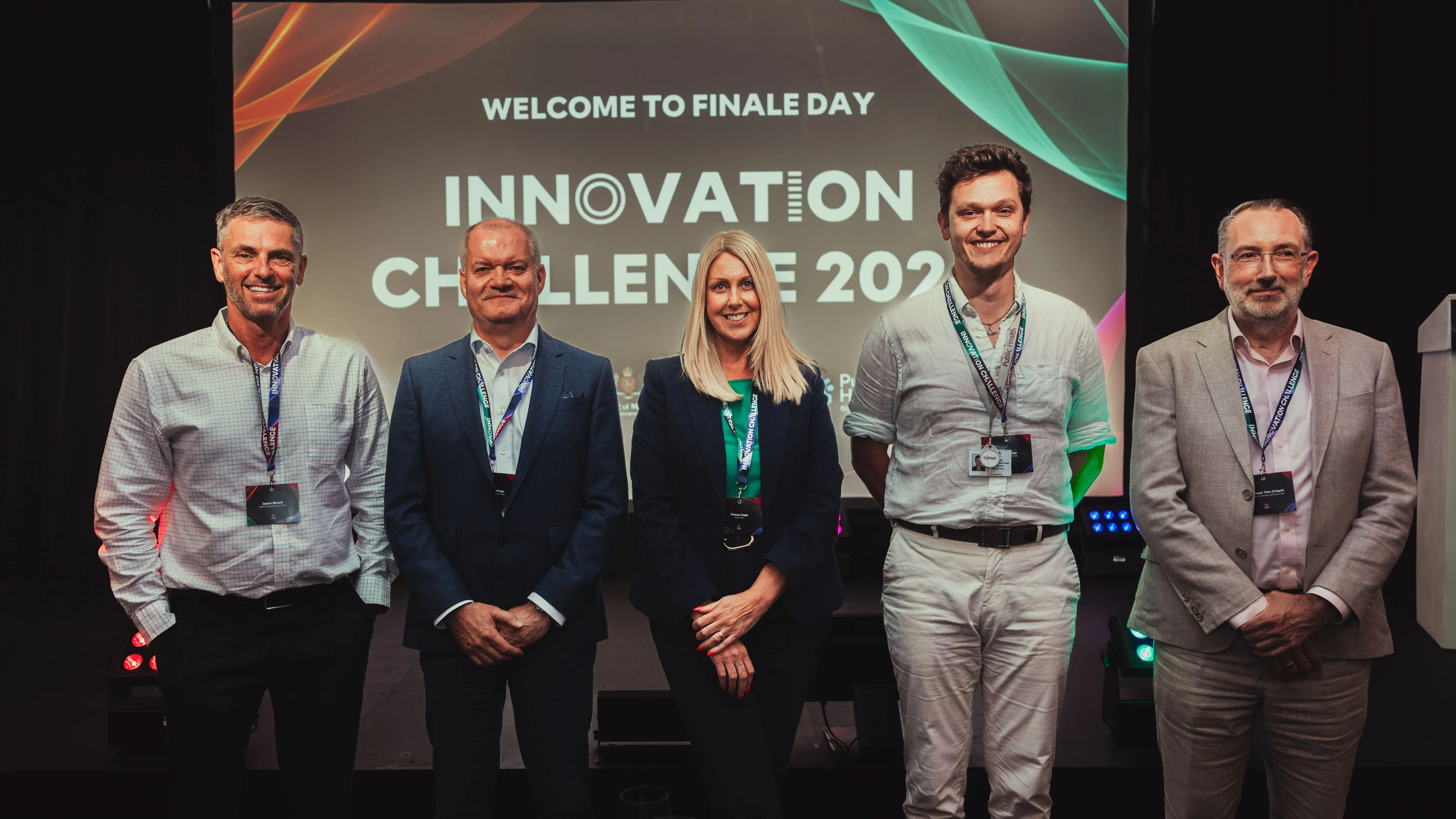 Five finalists standing together in front of a "Welcome to Finale Day" screen at Innovation Challenge 2026