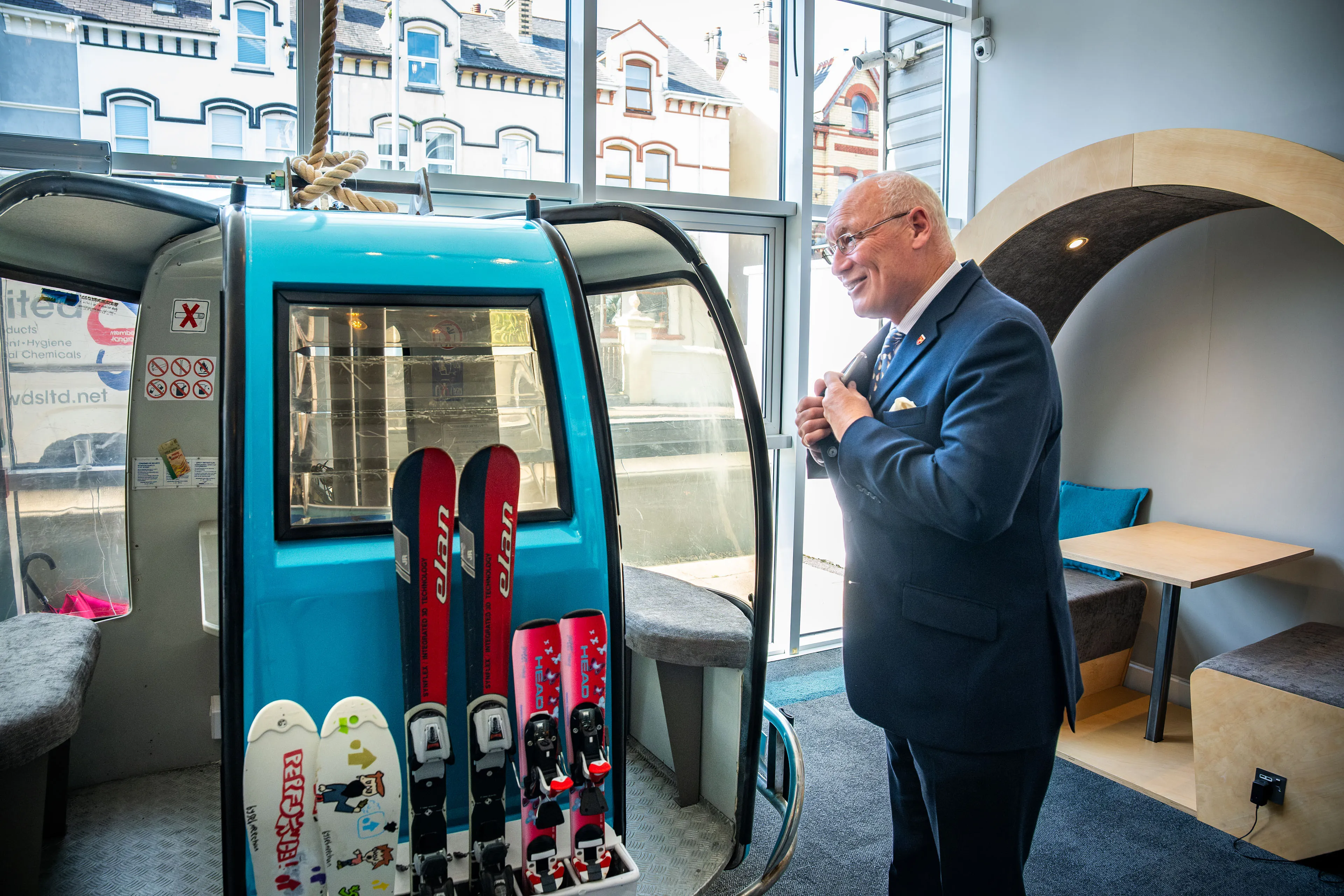 Lieutenant General Sir John Lorimer KCB DSO MBE smiling as he gets ready to step into the DotPerformance gondola pod
