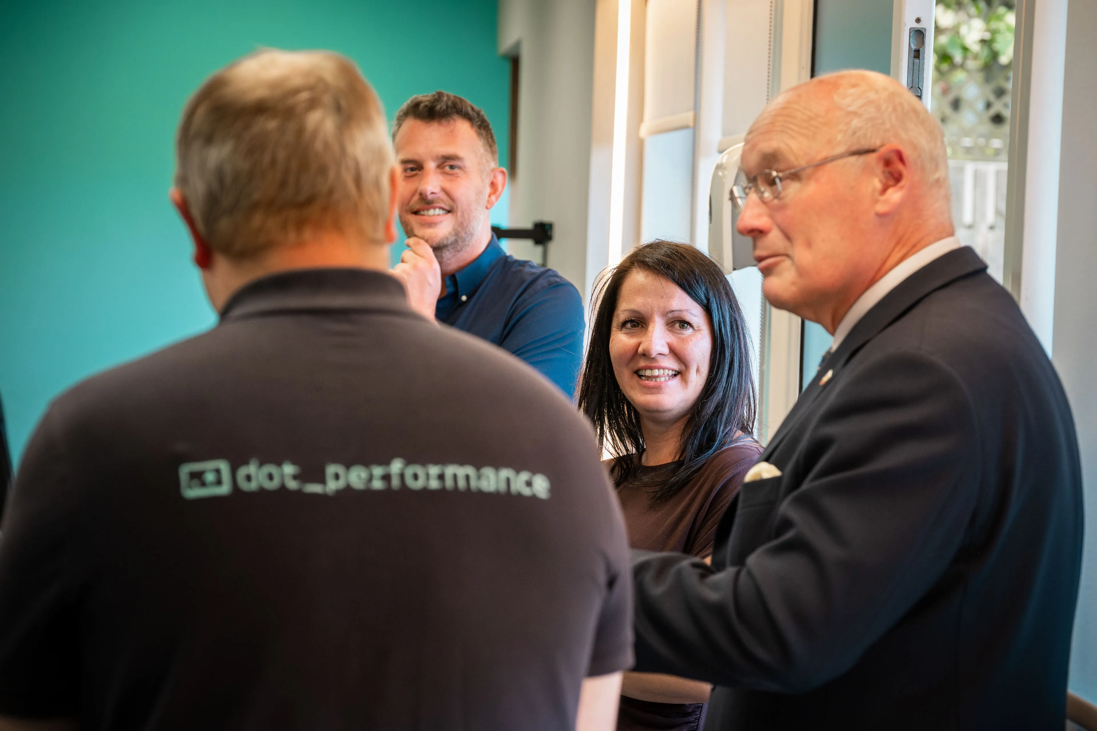 Raluca Matei and Andy Orton smiling as Lieutenant General Sir John Lorimer KCB DSO MBE recollects a memory